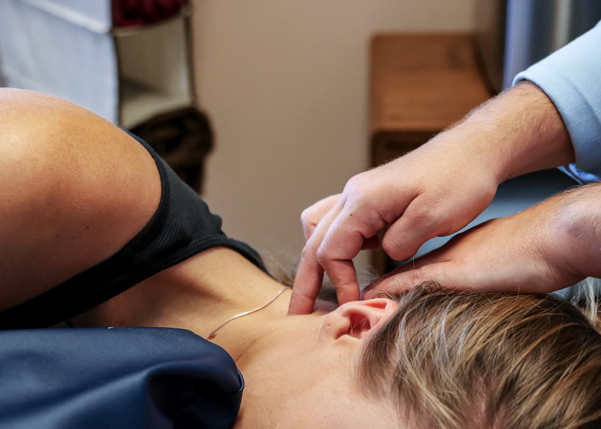 Gentle CranioSacral therapy session at A Time to Heal — light-touch work at the neck and head